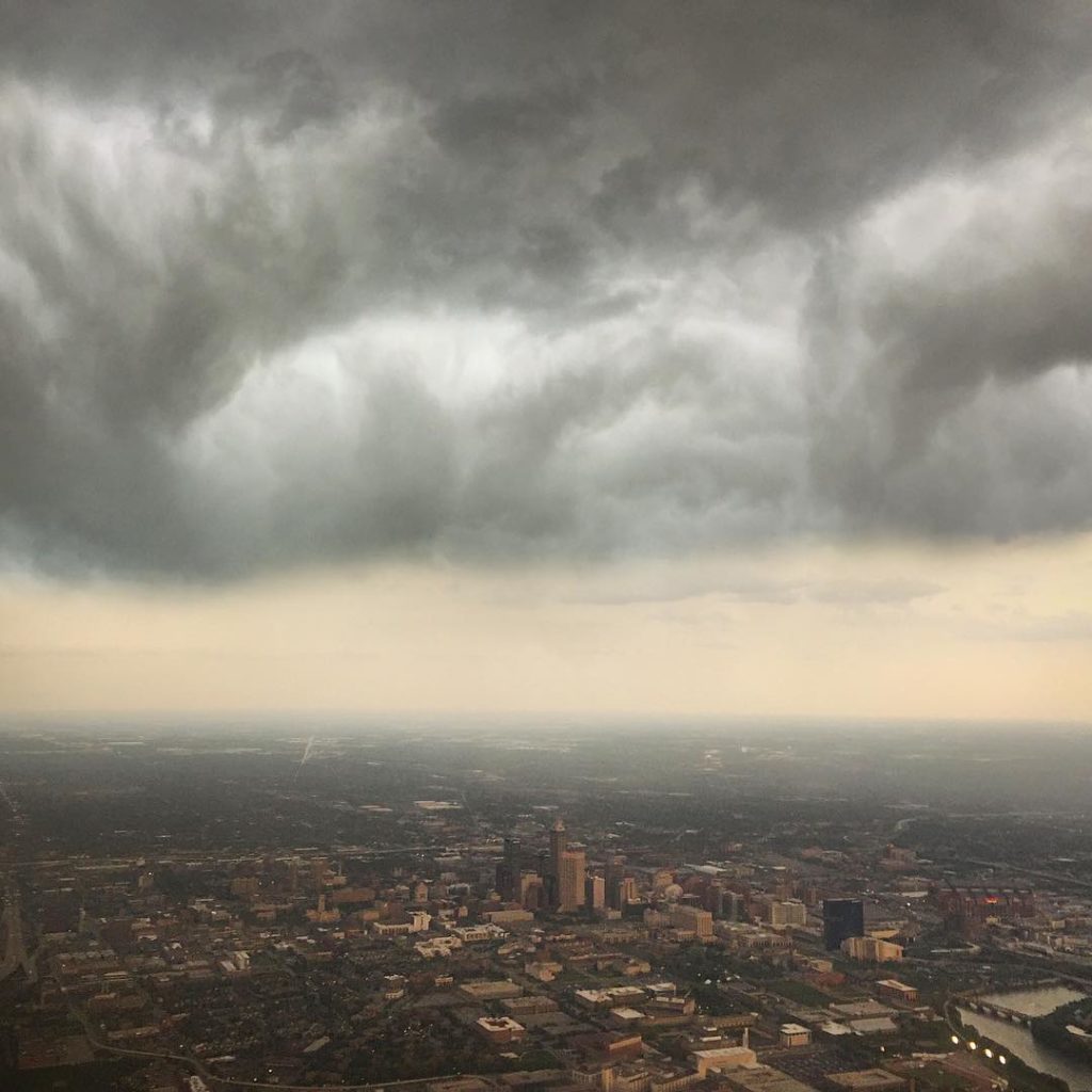 Heavy storm clouds over a Midwestern city.